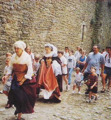 Marie Stuart - Fleur d'Ecosse performance at Bolton Castle. Marie with maidservant and audience in Bolton Castle courtyard.